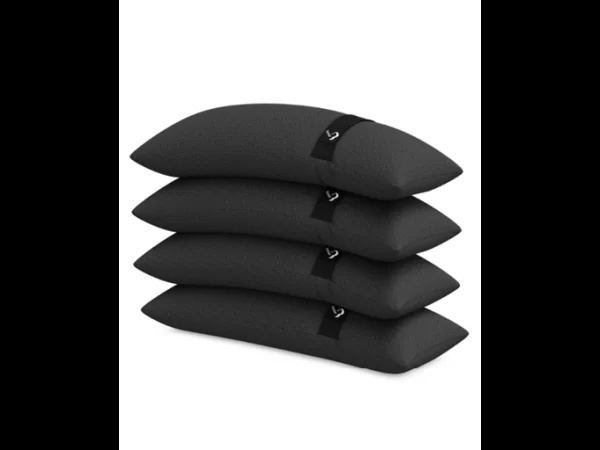 Eight shirts arranged on table in black, olive, grey, blue, white, red, mustard, and green.