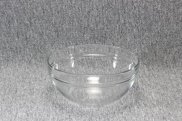 Eight shirts arranged on table in black, olive, grey, blue, white, red, mustard, and green.