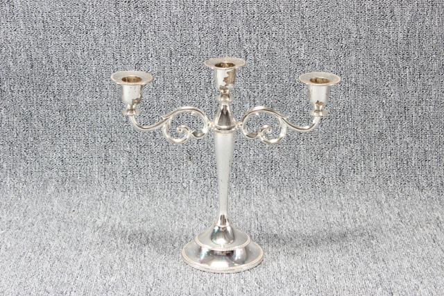 Eight shirts arranged on table in black, olive, grey, blue, white, red, mustard, and green.