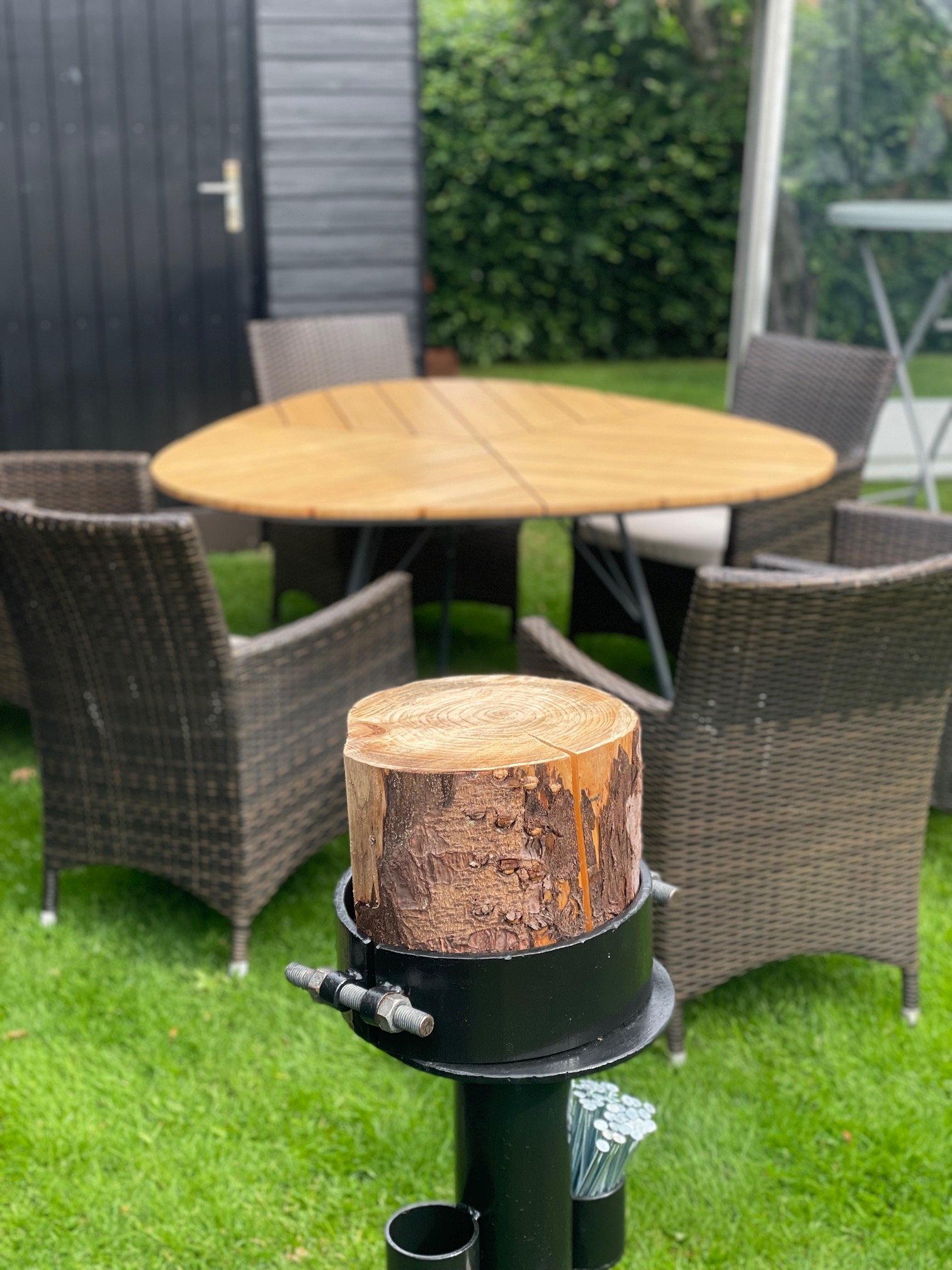 Eight shirts arranged on table in black, olive, grey, blue, white, red, mustard, and green.
