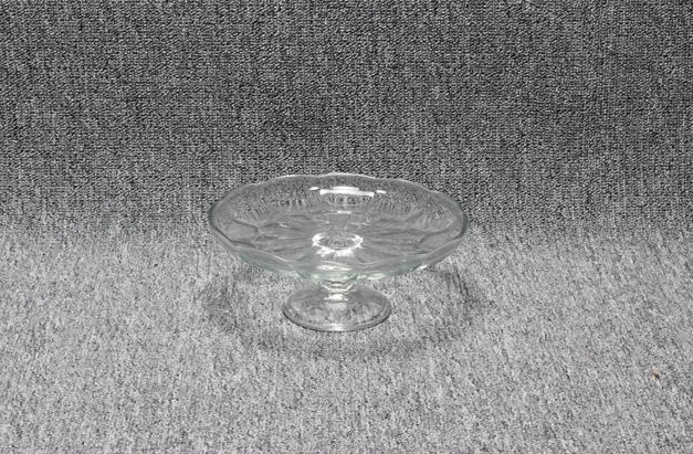 Eight shirts arranged on table in black, olive, grey, blue, white, red, mustard, and green.