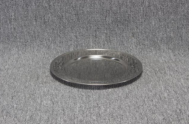 Eight shirts arranged on table in black, olive, grey, blue, white, red, mustard, and green.