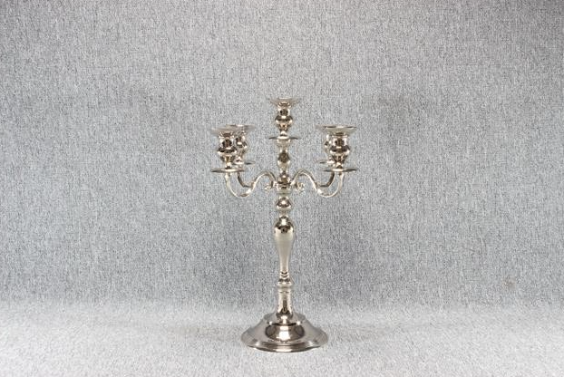 Eight shirts arranged on table in black, olive, grey, blue, white, red, mustard, and green.