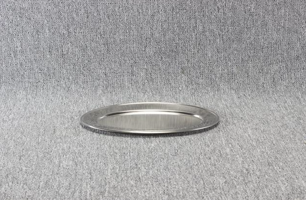 Eight shirts arranged on table in black, olive, grey, blue, white, red, mustard, and green.