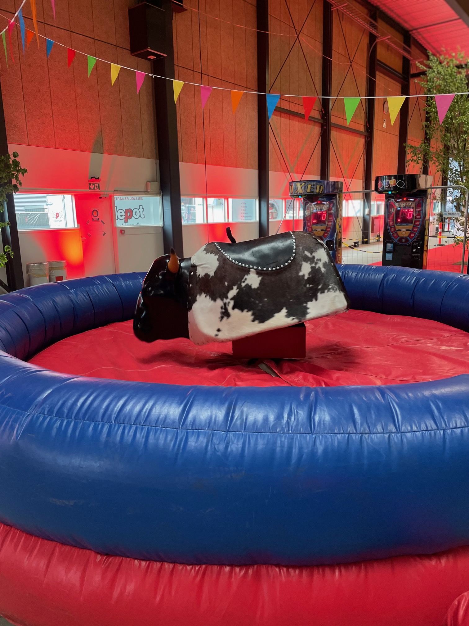 Eight shirts arranged on table in black, olive, grey, blue, white, red, mustard, and green.