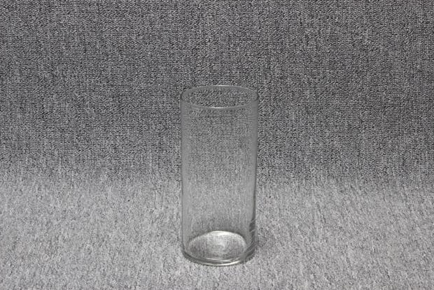 Eight shirts arranged on table in black, olive, grey, blue, white, red, mustard, and green.