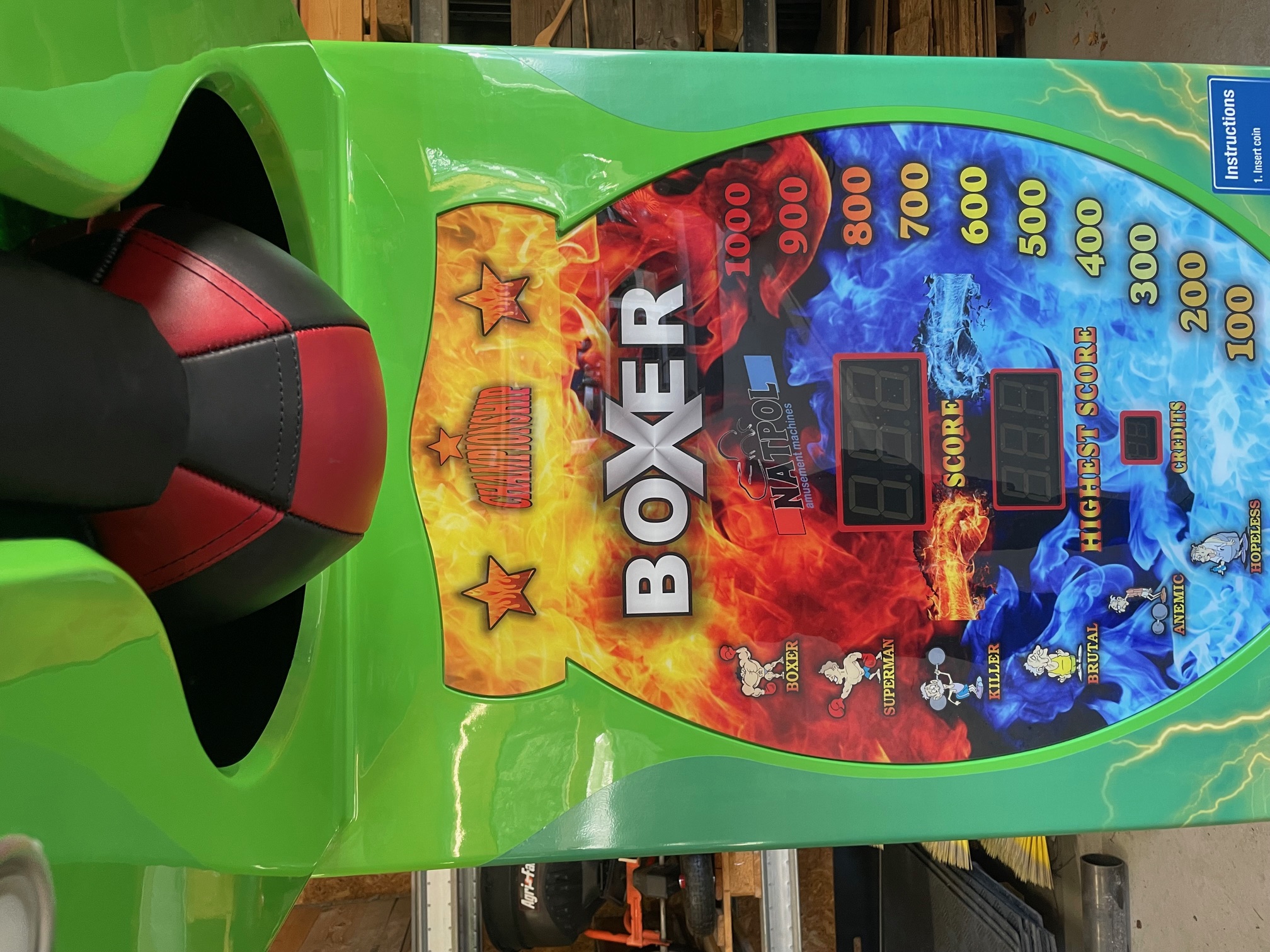 Eight shirts arranged on table in black, olive, grey, blue, white, red, mustard, and green.