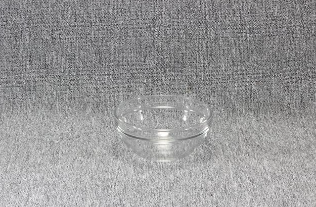 Eight shirts arranged on table in black, olive, grey, blue, white, red, mustard, and green.