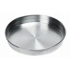 Eight shirts arranged on table in black, olive, grey, blue, white, red, mustard, and green.