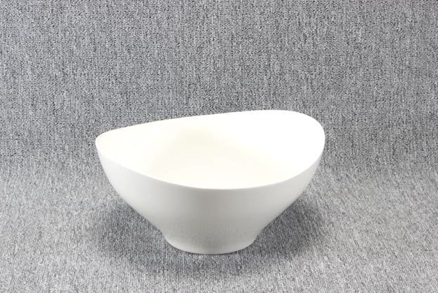 Eight shirts arranged on table in black, olive, grey, blue, white, red, mustard, and green.