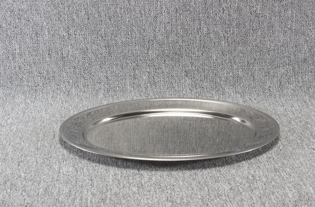 Eight shirts arranged on table in black, olive, grey, blue, white, red, mustard, and green.