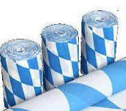 Eight shirts arranged on table in black, olive, grey, blue, white, red, mustard, and green.