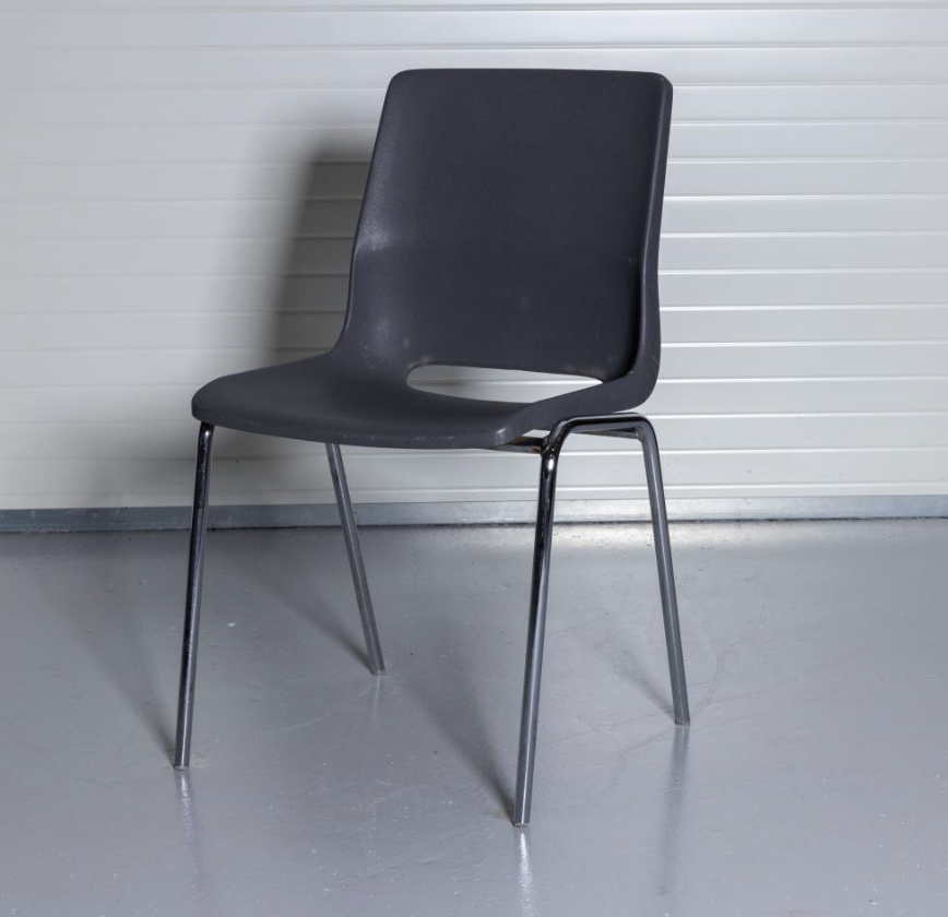 Eight shirts arranged on table in black, olive, grey, blue, white, red, mustard, and green.