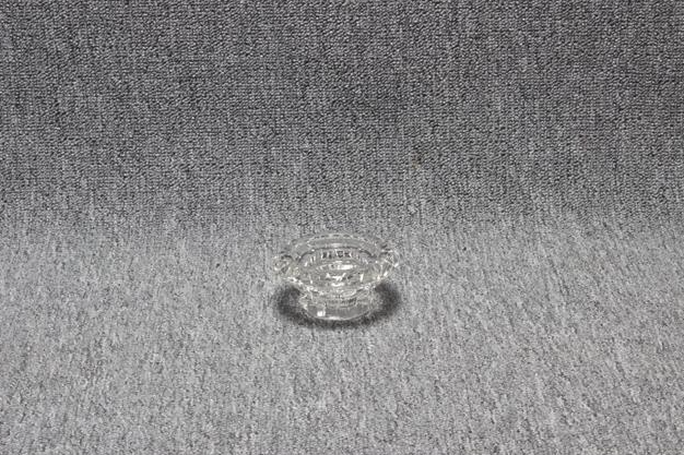 Eight shirts arranged on table in black, olive, grey, blue, white, red, mustard, and green.