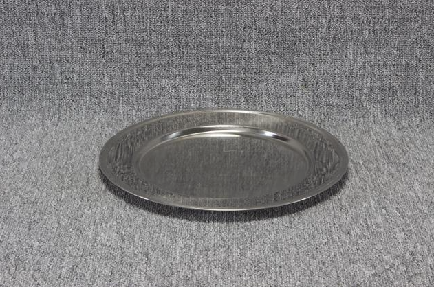 Eight shirts arranged on table in black, olive, grey, blue, white, red, mustard, and green.