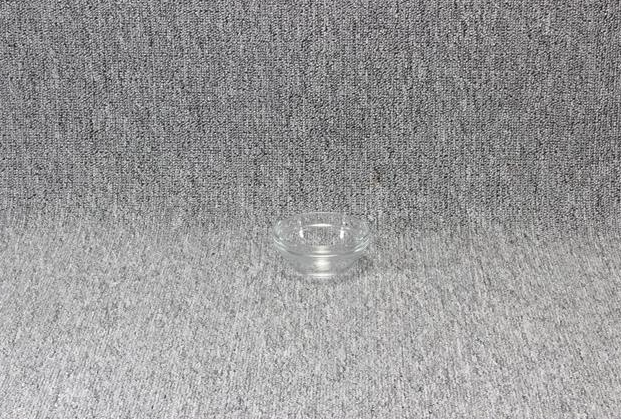 Eight shirts arranged on table in black, olive, grey, blue, white, red, mustard, and green.