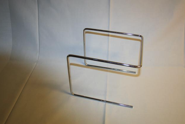 Eight shirts arranged on table in black, olive, grey, blue, white, red, mustard, and green.