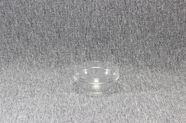 Eight shirts arranged on table in black, olive, grey, blue, white, red, mustard, and green.