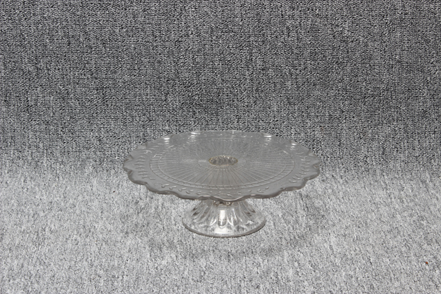 Eight shirts arranged on table in black, olive, grey, blue, white, red, mustard, and green.