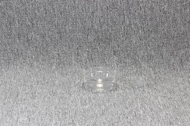 Eight shirts arranged on table in black, olive, grey, blue, white, red, mustard, and green.