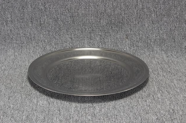 Eight shirts arranged on table in black, olive, grey, blue, white, red, mustard, and green.