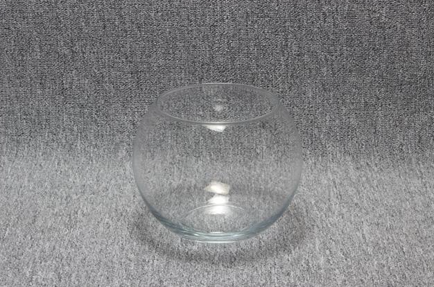 Eight shirts arranged on table in black, olive, grey, blue, white, red, mustard, and green.