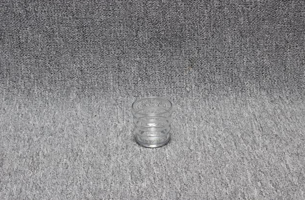 Eight shirts arranged on table in black, olive, grey, blue, white, red, mustard, and green.