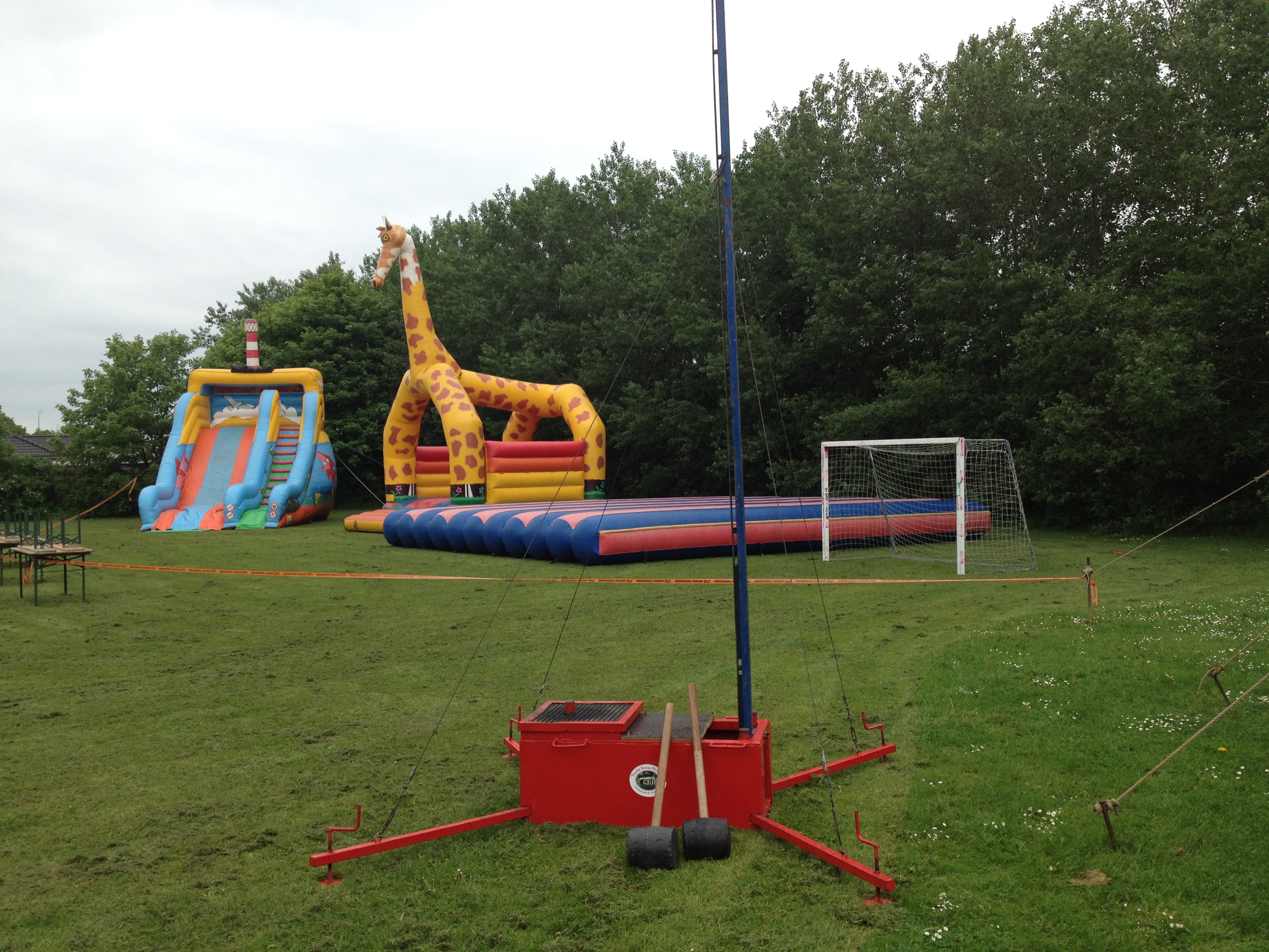 Eight shirts arranged on table in black, olive, grey, blue, white, red, mustard, and green.