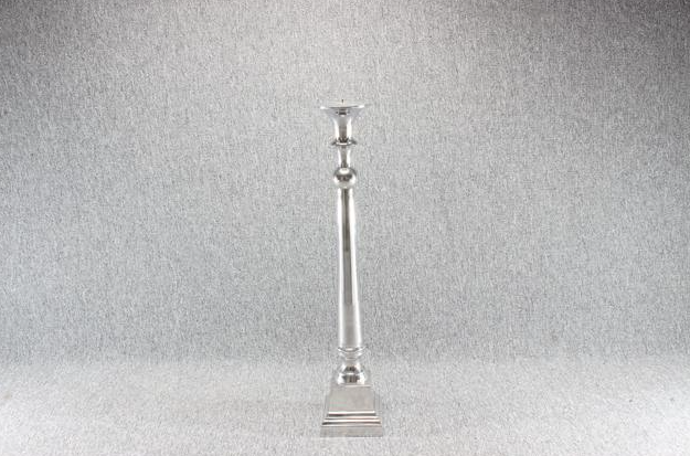 Eight shirts arranged on table in black, olive, grey, blue, white, red, mustard, and green.