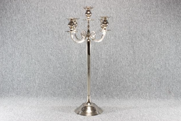 Eight shirts arranged on table in black, olive, grey, blue, white, red, mustard, and green.