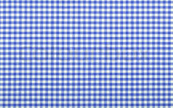 Eight shirts arranged on table in black, olive, grey, blue, white, red, mustard, and green.