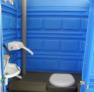 Eight shirts arranged on table in black, olive, grey, blue, white, red, mustard, and green.