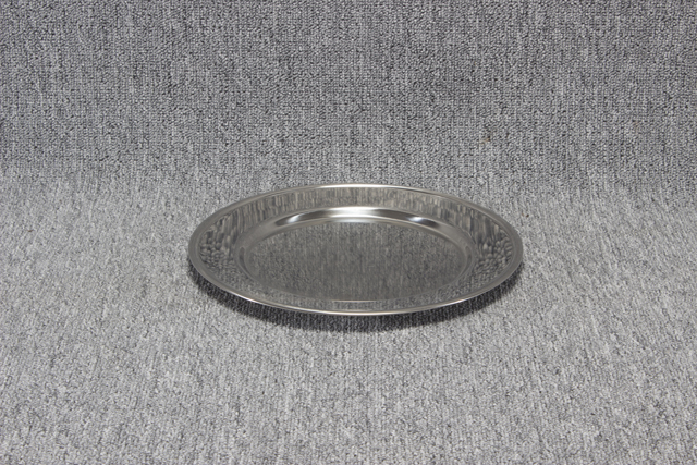 Eight shirts arranged on table in black, olive, grey, blue, white, red, mustard, and green.