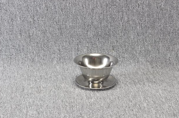 Eight shirts arranged on table in black, olive, grey, blue, white, red, mustard, and green.