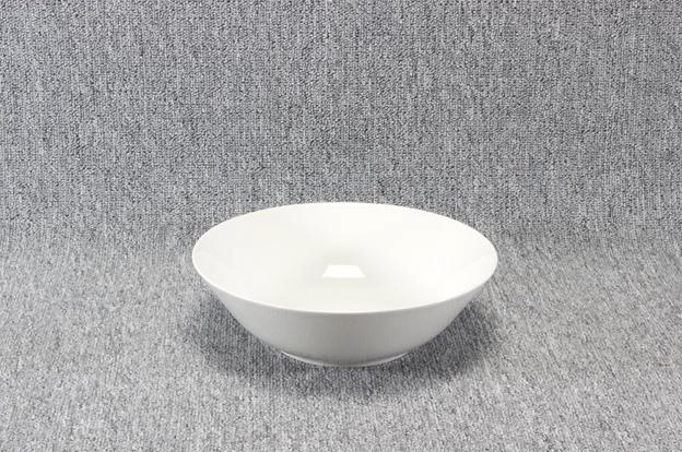 Eight shirts arranged on table in black, olive, grey, blue, white, red, mustard, and green.