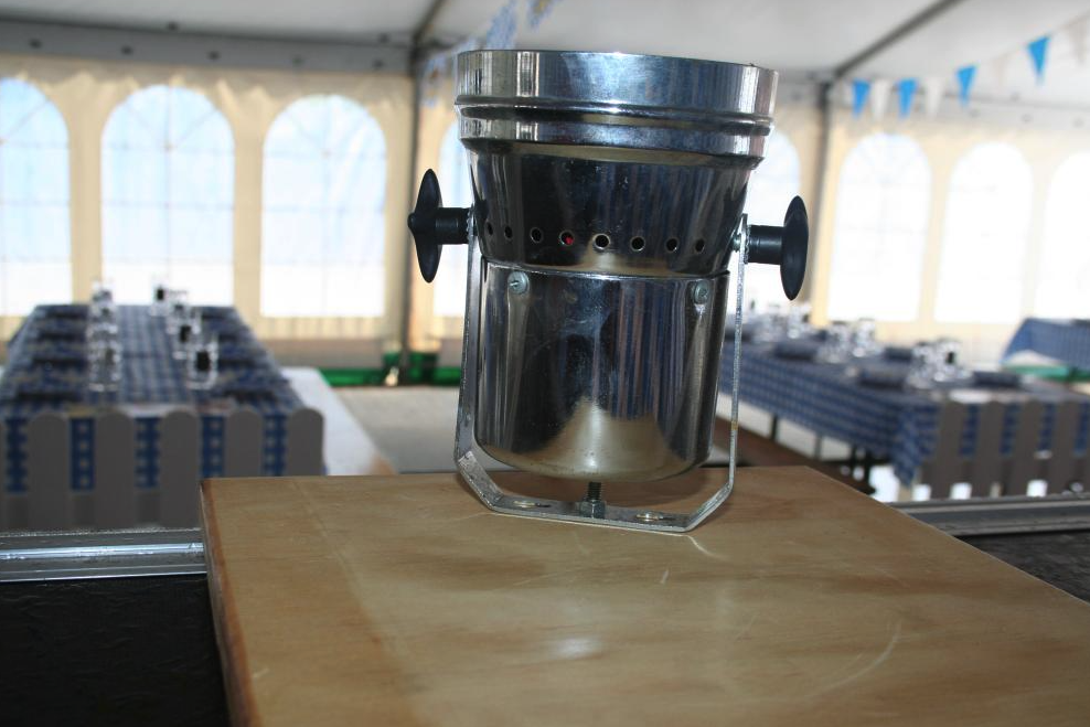 Eight shirts arranged on table in black, olive, grey, blue, white, red, mustard, and green.