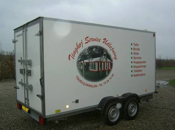 Eight shirts arranged on table in black, olive, grey, blue, white, red, mustard, and green.