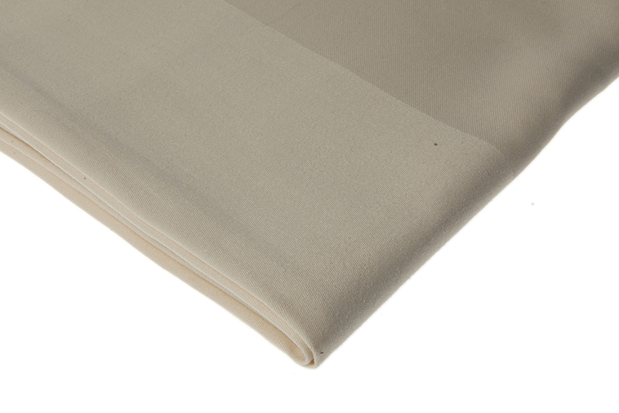 Eight shirts arranged on table in black, olive, grey, blue, white, red, mustard, and green.