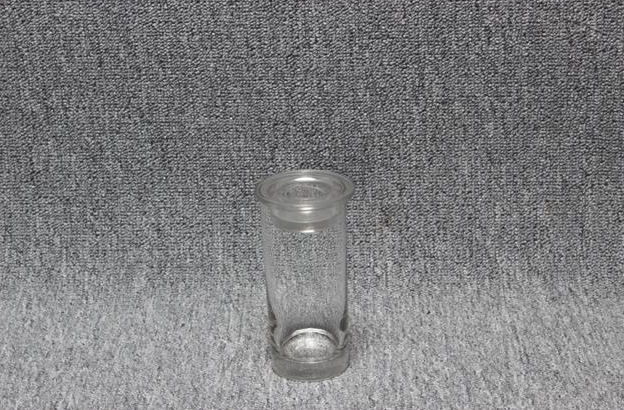 Eight shirts arranged on table in black, olive, grey, blue, white, red, mustard, and green.