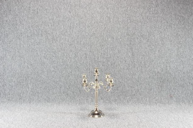 Eight shirts arranged on table in black, olive, grey, blue, white, red, mustard, and green.