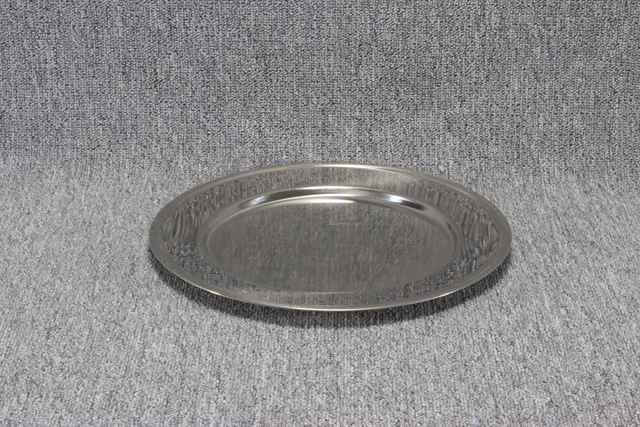 Eight shirts arranged on table in black, olive, grey, blue, white, red, mustard, and green.