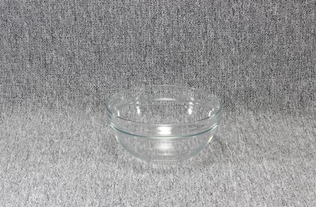 Eight shirts arranged on table in black, olive, grey, blue, white, red, mustard, and green.