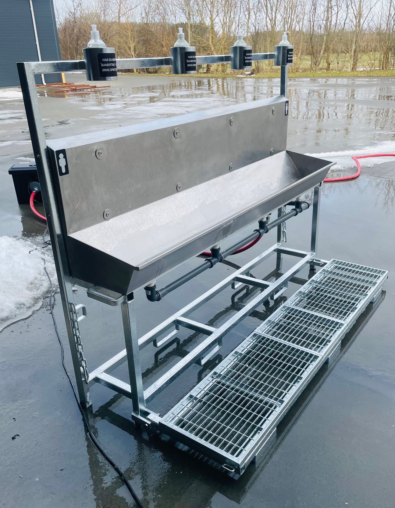 Eight shirts arranged on table in black, olive, grey, blue, white, red, mustard, and green.