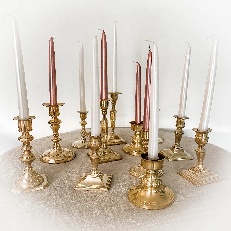 Eight shirts arranged on table in black, olive, grey, blue, white, red, mustard, and green.