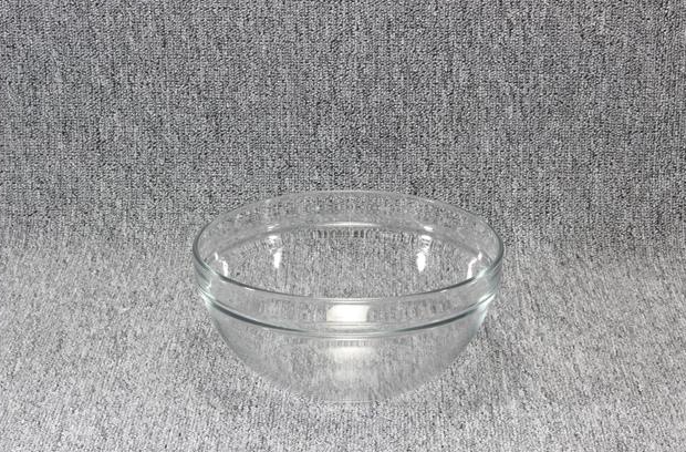 Eight shirts arranged on table in black, olive, grey, blue, white, red, mustard, and green.